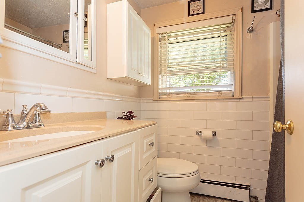 38 McDevitt Road Randolph, MA 02368 - Photo 11 of 22 a bathroom with a sink and a toilet