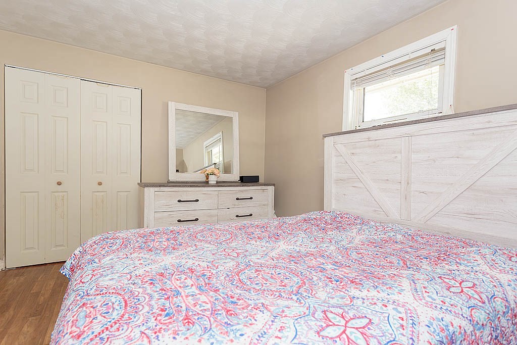 38 McDevitt Road Randolph, MA 02368 - Photo 12 of 22 a bedroom with a large bed and a window