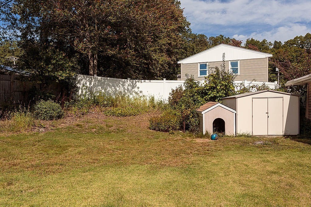 38 McDevitt Road Randolph, MA 02368 - Photo 20 of 22 a view of a house with backyard and tree