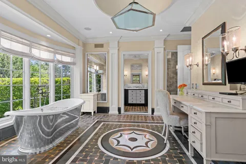 a spacious bathroom with a large window and a mirror