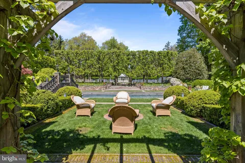 a view of a backyard with sitting area