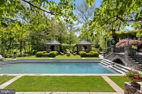a front view of a house with garden and patio