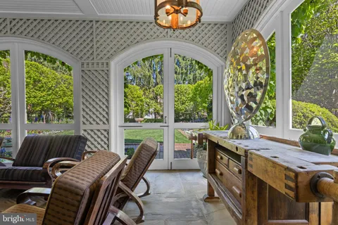 a dining room with a large window and table