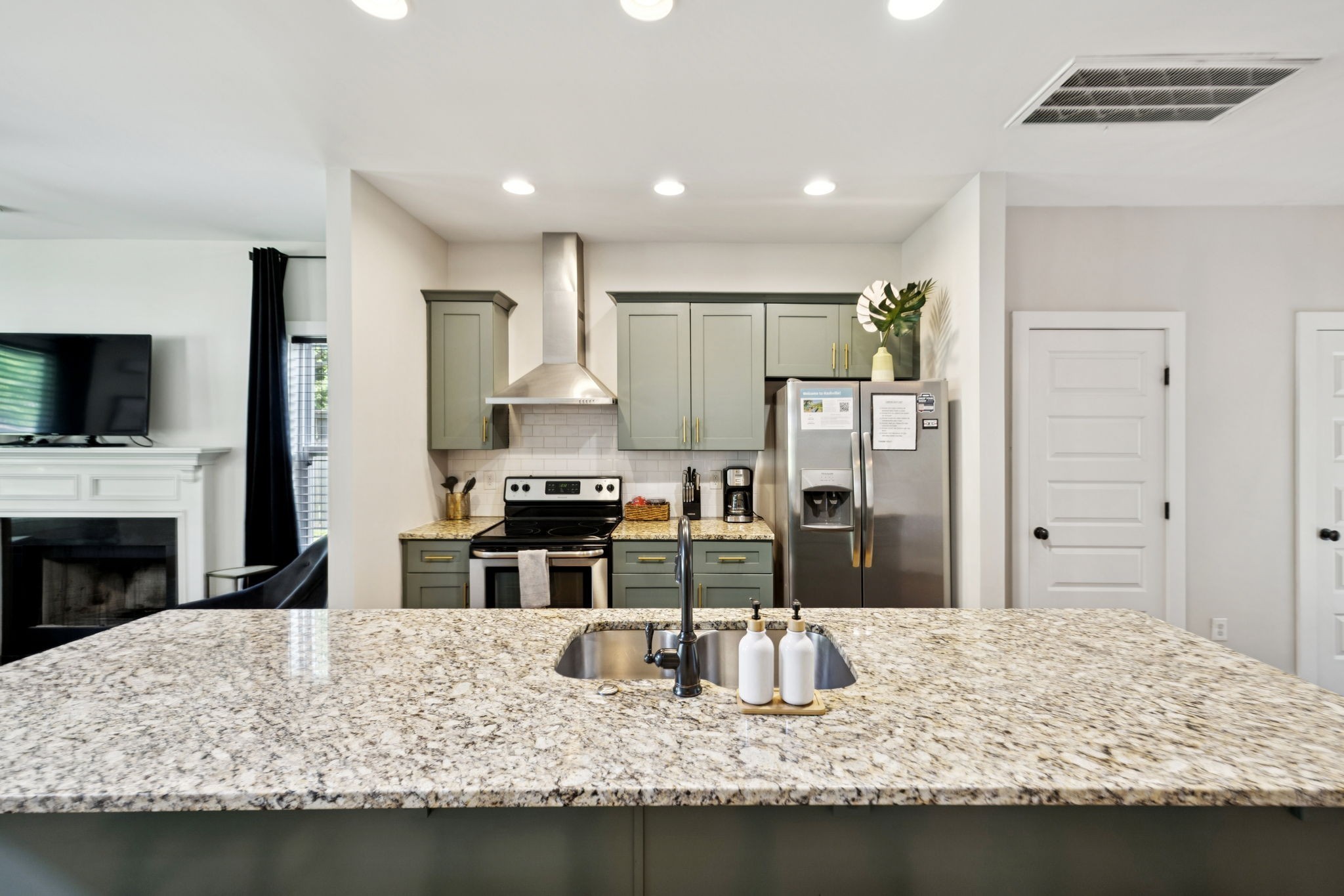 914 Blue Ridge Drive Nashville, TN 37207 - Photo 12 of 33 a kitchen with kitchen island granite countertop a sink stove and refrigerator