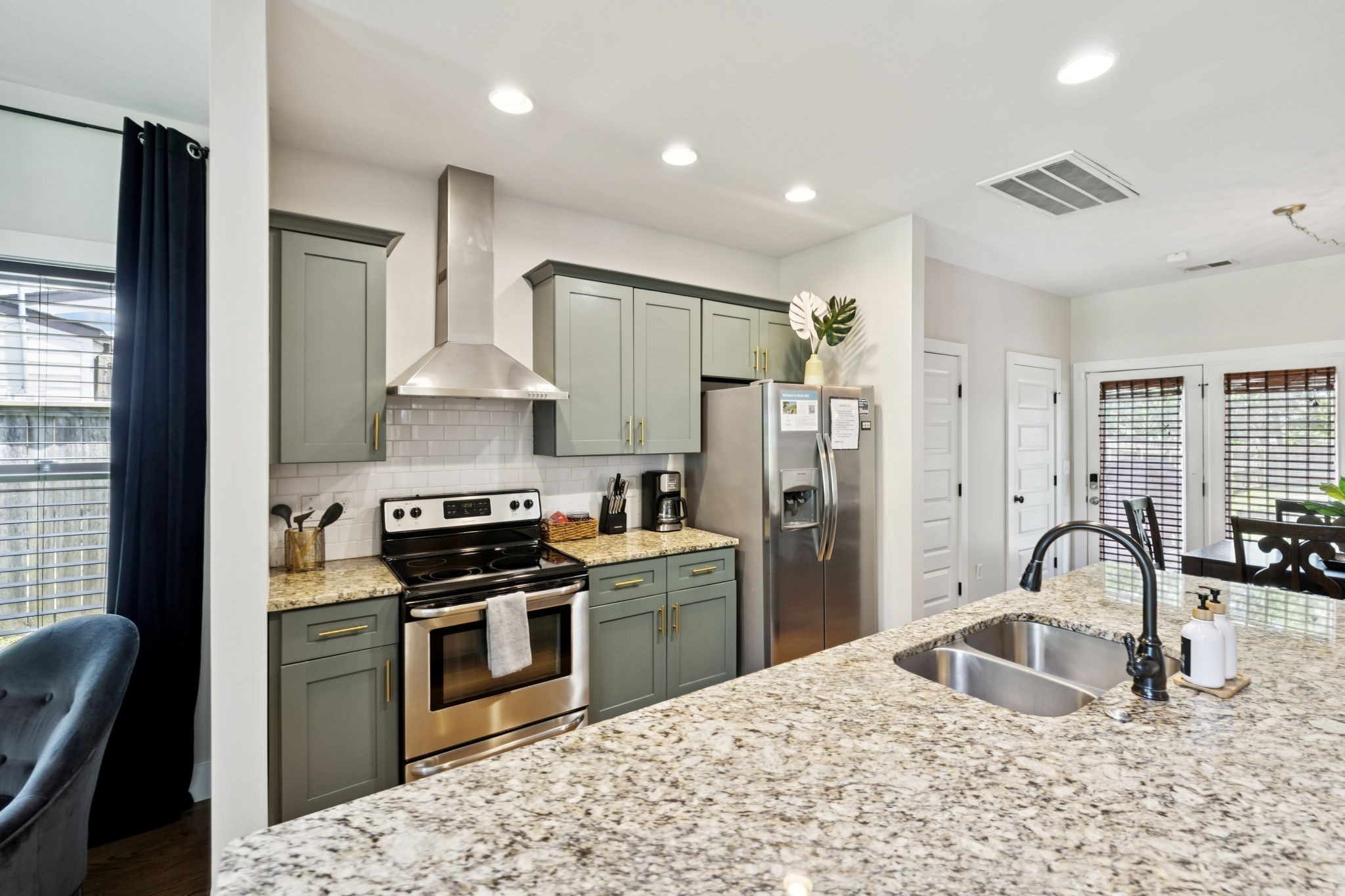 914 Blue Ridge Drive Nashville, TN 37207 - Photo 10 of 33 a kitchen with stainless steel appliances granite countertop a sink stove and refrigerator