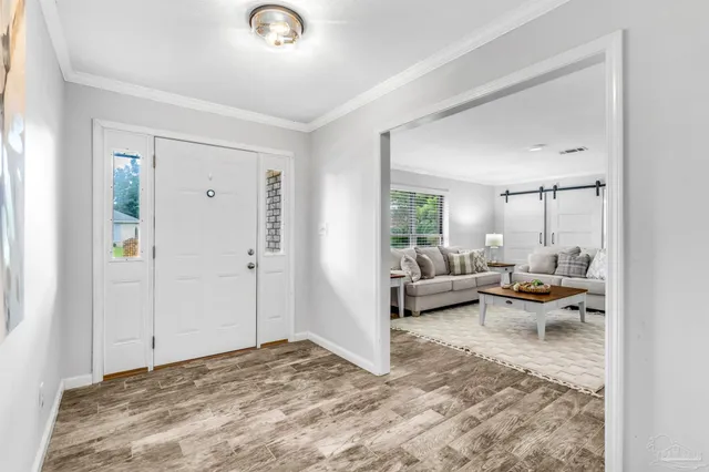 a living room with furniture and a table