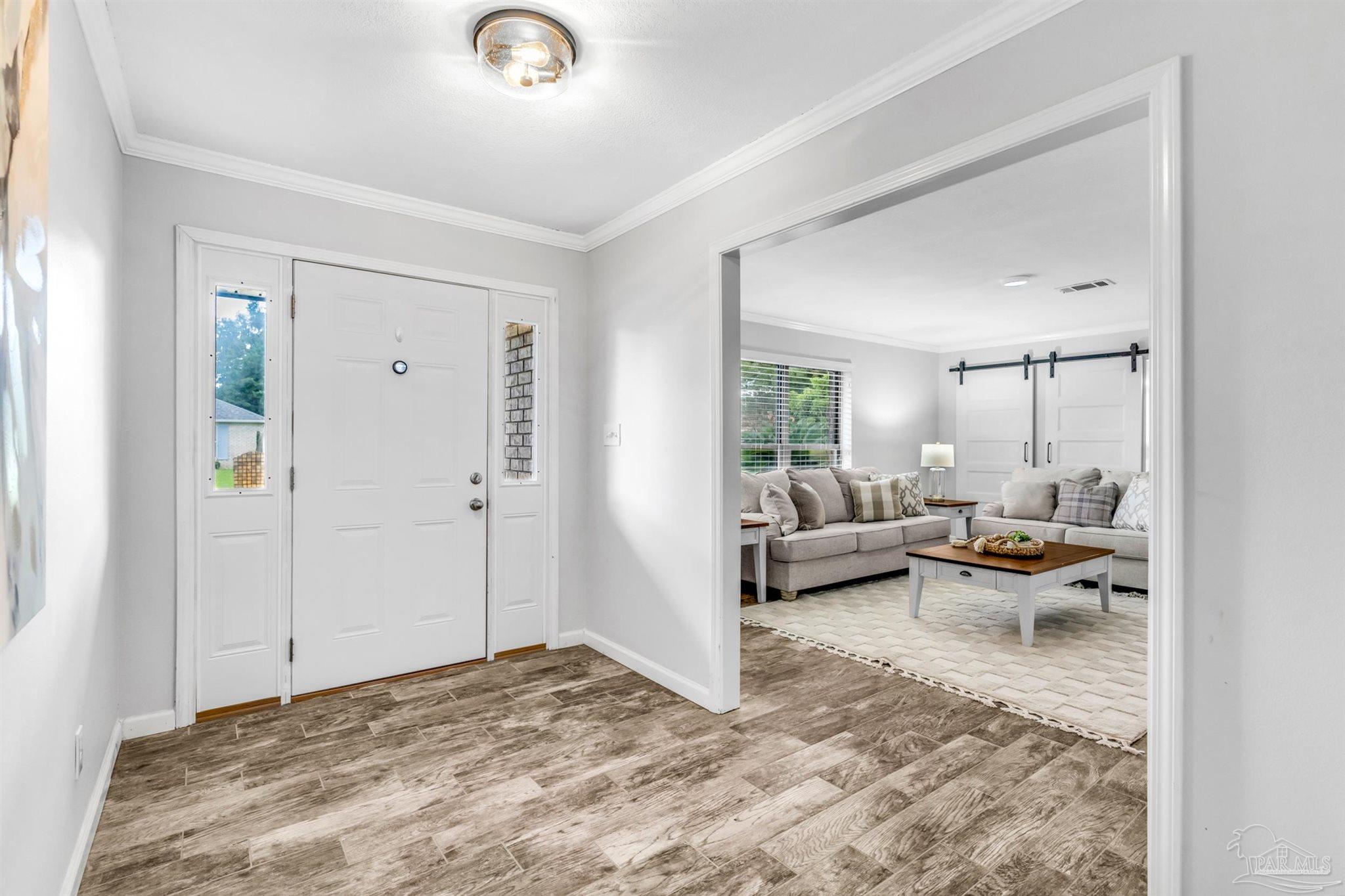 6912 Kitty Hawk Drive Pensacola, FL 32506 - Photo 13 of 61 a view of a living room