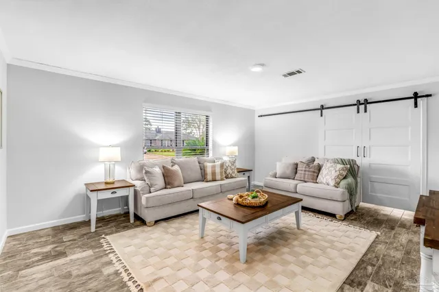 a living room with furniture and a table
