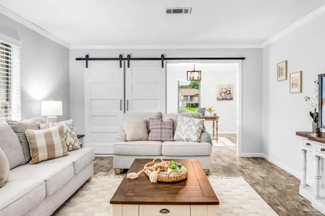 a bedroom with a bed and a table in it