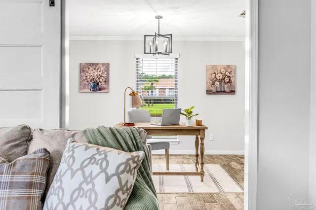 a bedroom with a table and bed
