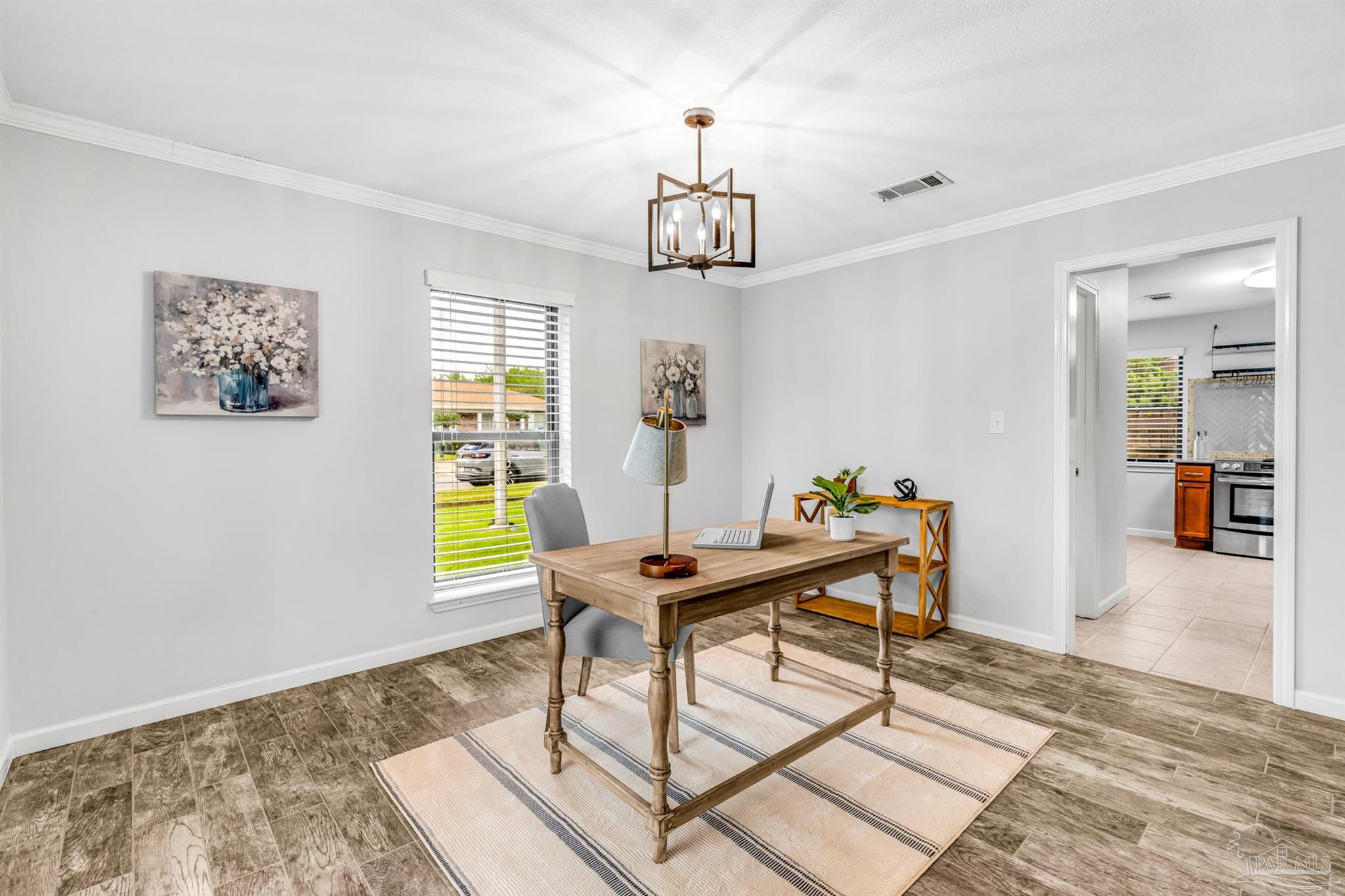 6912 Kitty Hawk Drive Pensacola, FL 32506 - Photo 21 of 61 a workspace with furniture and a window