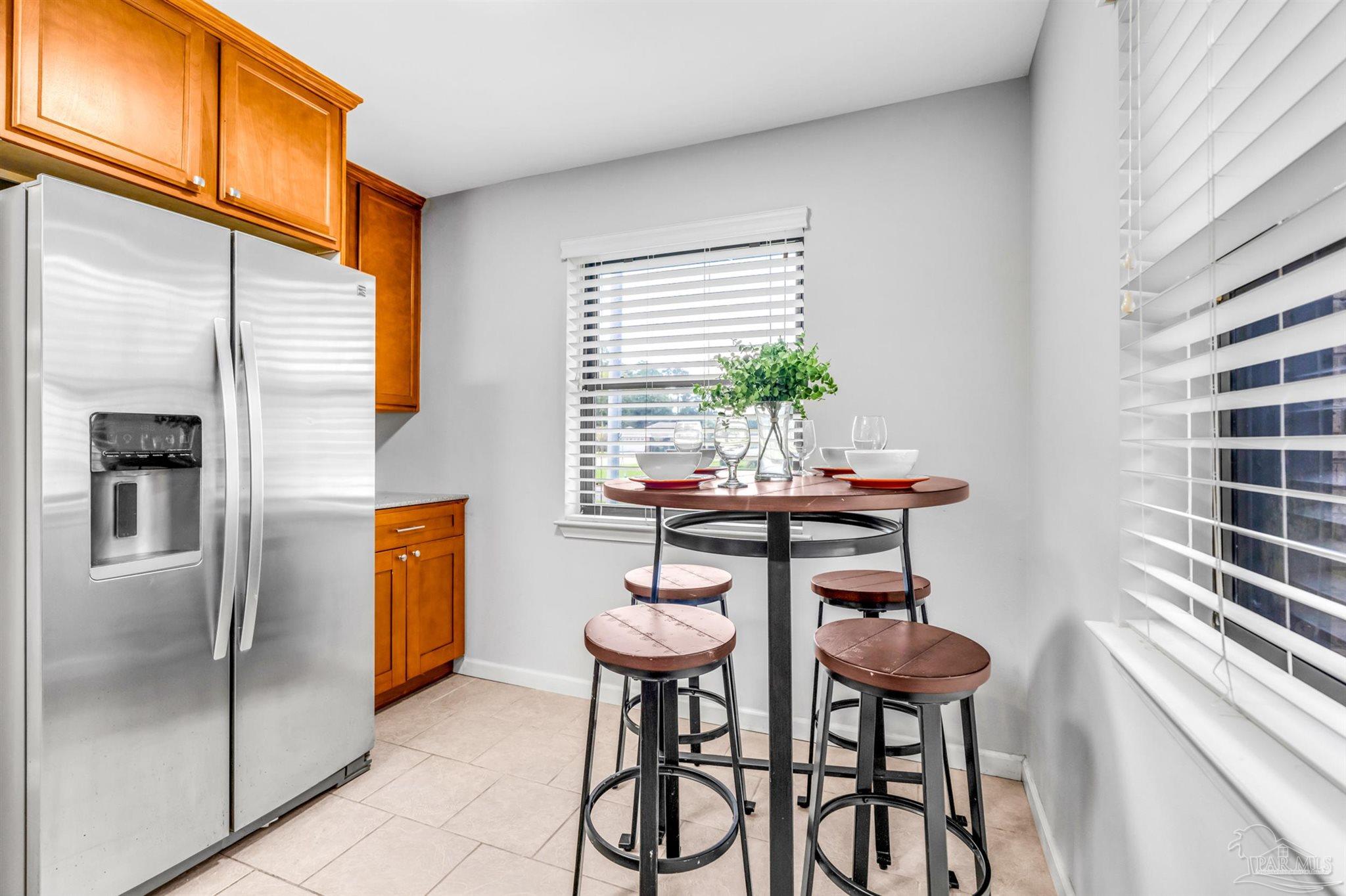 6912 Kitty Hawk Drive Pensacola, FL 32506 - Photo 28 of 61 a dining room with furniture and window