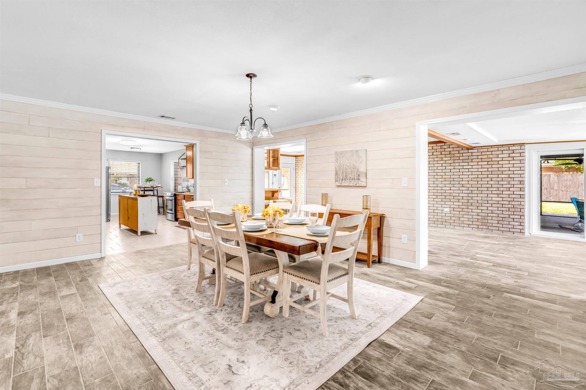 6912 Kitty Hawk Drive Pensacola, FL 32506 - Photo 30 of 61 a view of a dining room with furniture