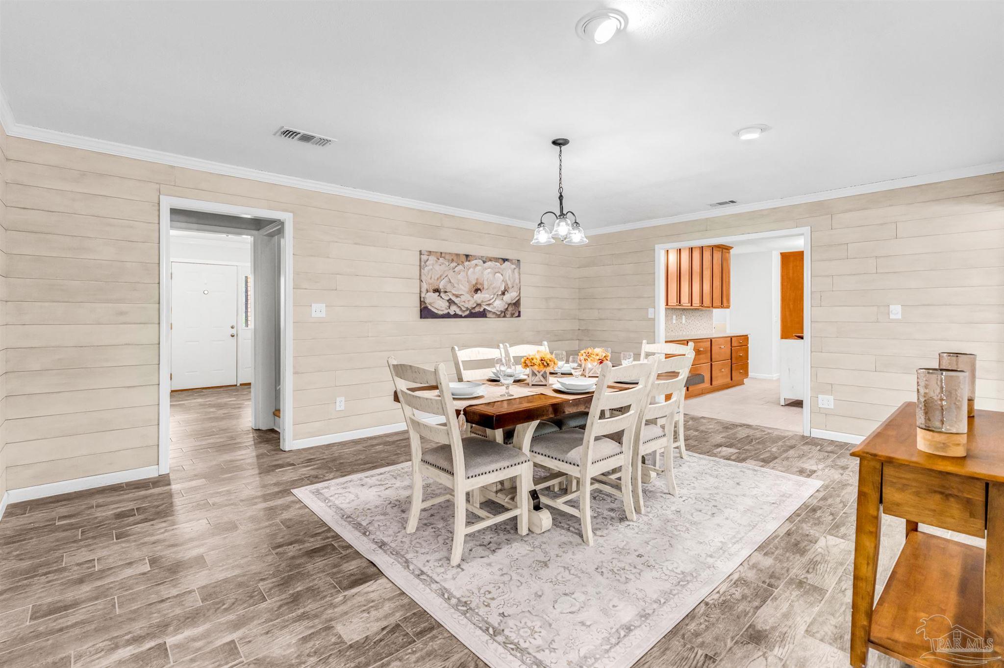 6912 Kitty Hawk Drive Pensacola, FL 32506 - Photo 31 of 61 a view of a dining room with furniture