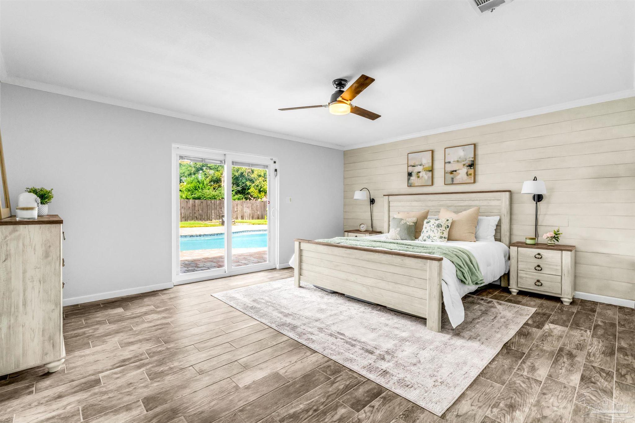 6912 Kitty Hawk Drive Pensacola, FL 32506 - Photo 36 of 61 a bedroom with a bed and a window