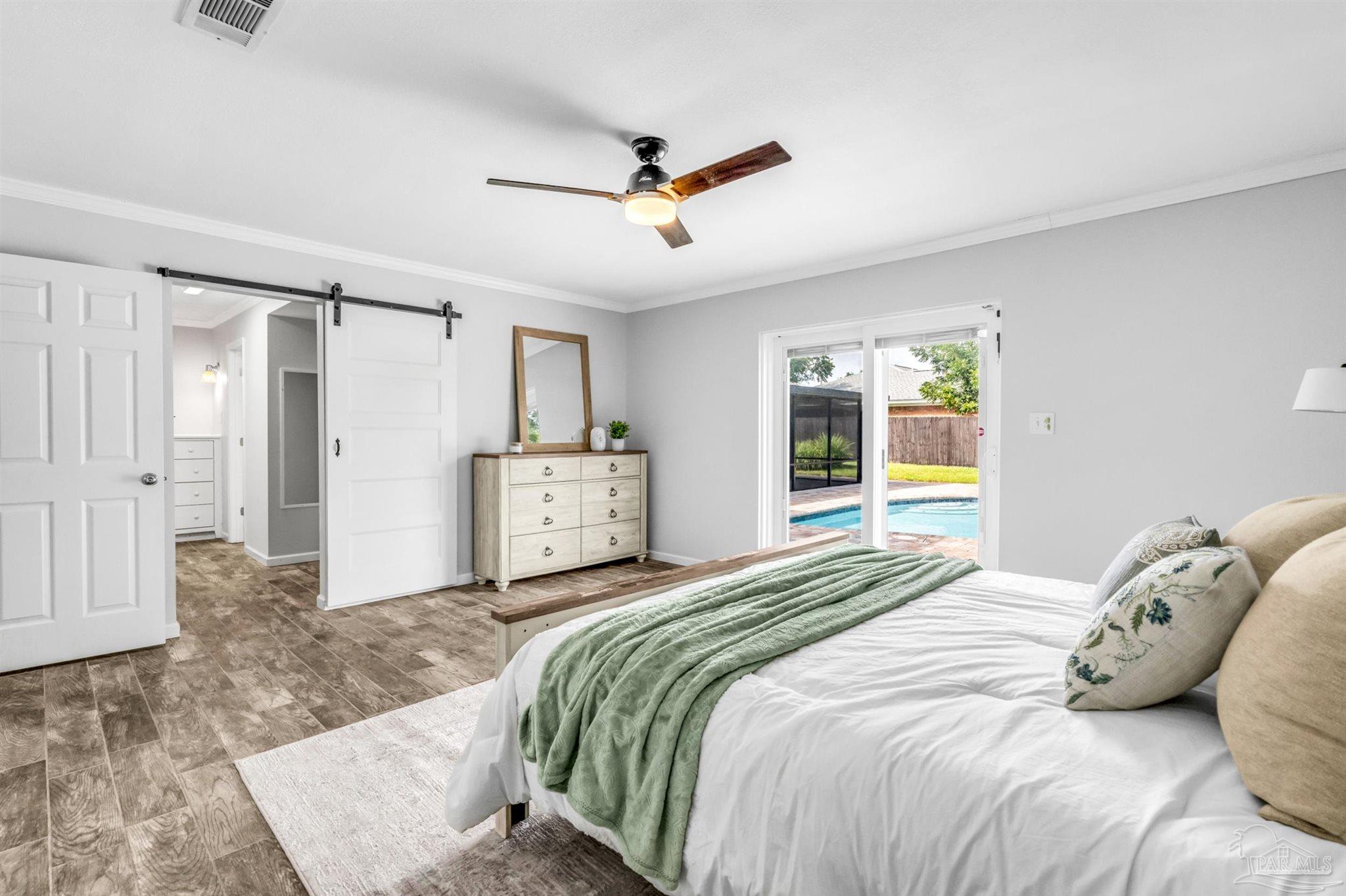 6912 Kitty Hawk Drive Pensacola, FL 32506 - Photo 37 of 61 a bedroom with a large bed and a window