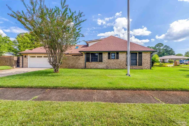 front view of a house with a yard