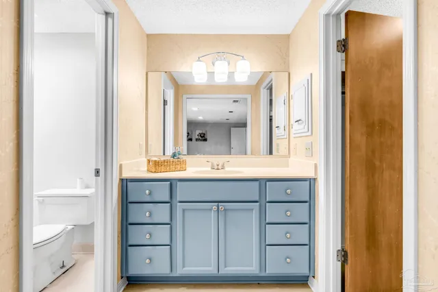 a bathroom with a toilet and a sink