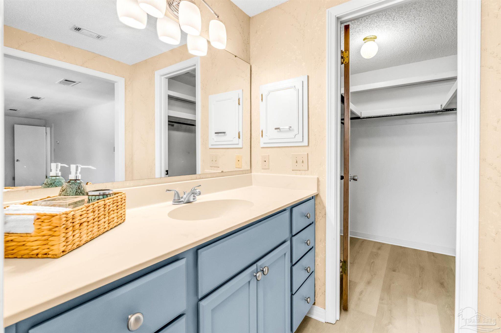 6912 Kitty Hawk Drive Pensacola, FL 32506 - Photo 44 of 61 a bathroom with a sink and a mirror