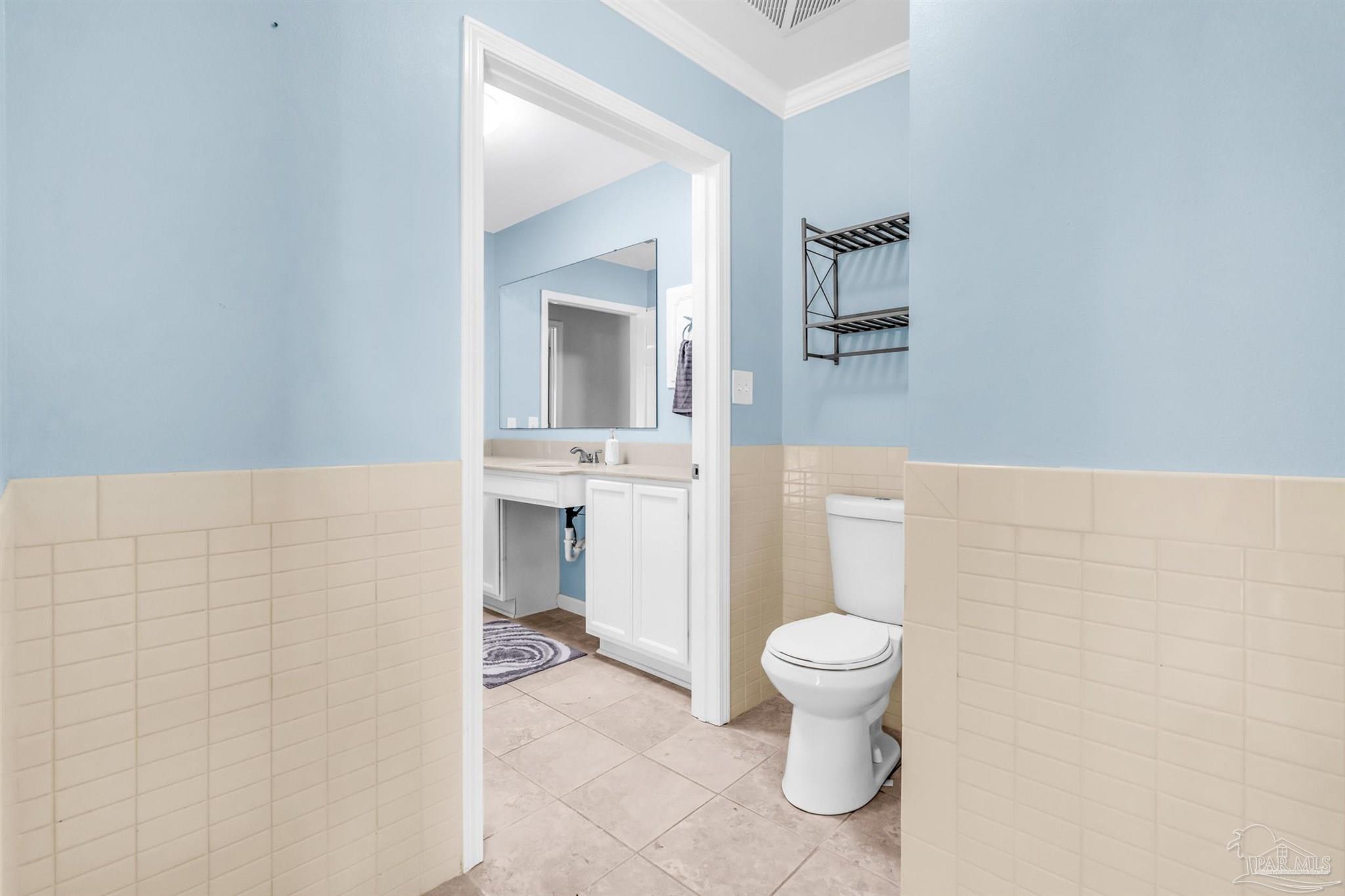 6912 Kitty Hawk Drive Pensacola, FL 32506 - Photo 50 of 61 a bathroom with a toilet and a sink