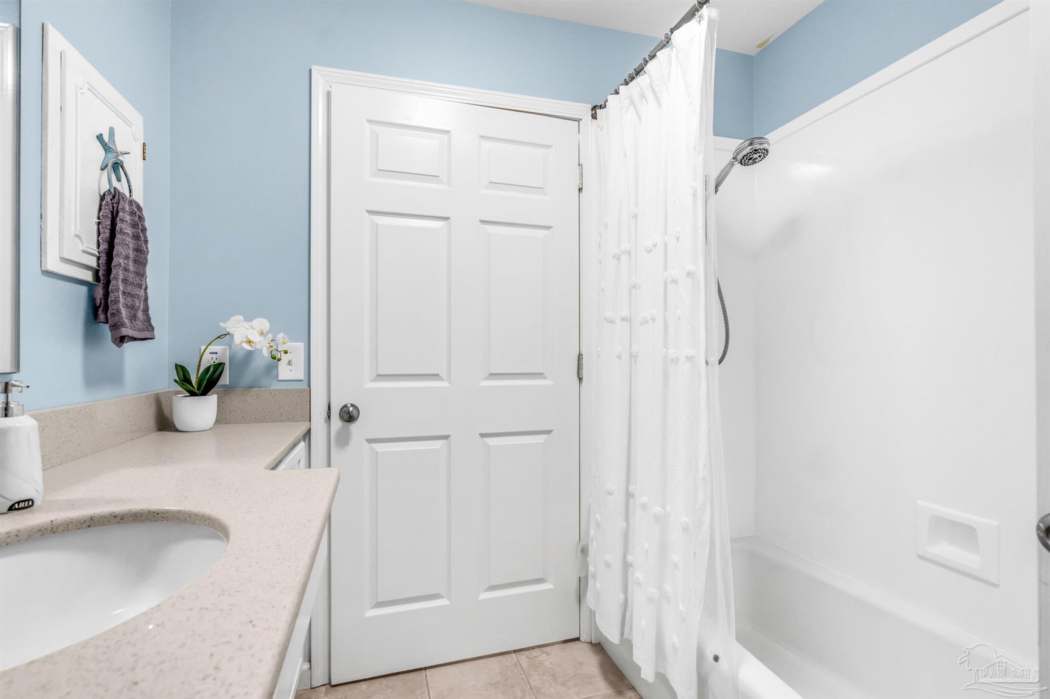 6912 Kitty Hawk Drive Pensacola, FL 32506 - Photo 51 of 61 a bathroom with a granite countertop sink a shower and a mirror
