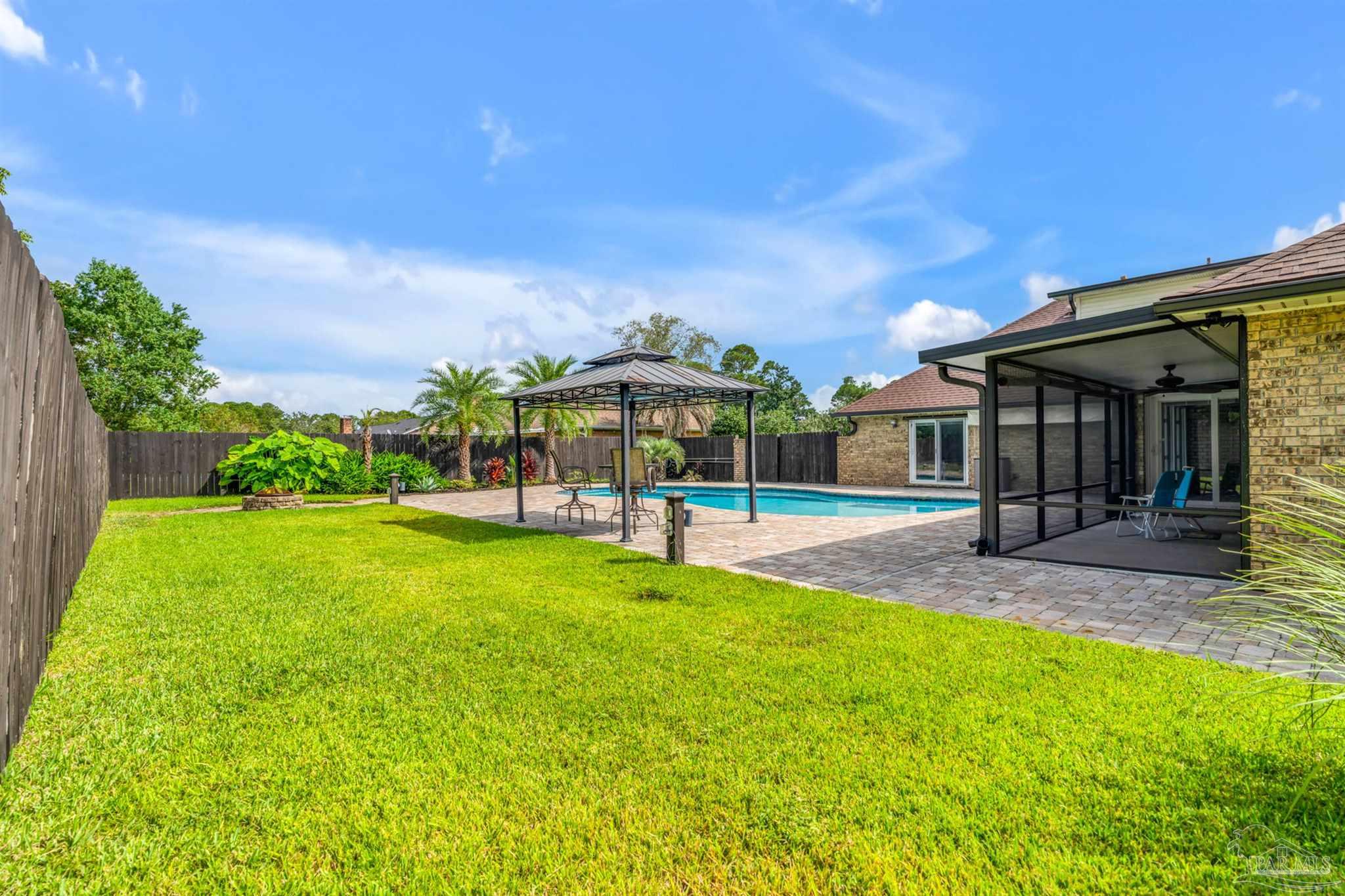 6912 Kitty Hawk Drive Pensacola, FL 32506 - Photo 52 of 61 a view of a house with a yard balcony and sitting area