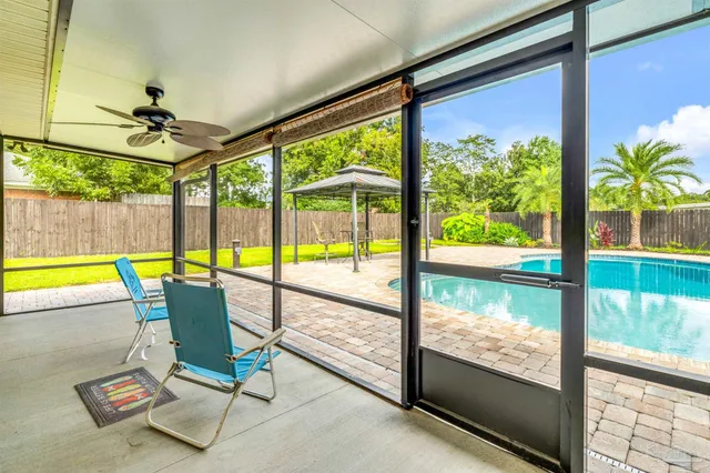a view of a swimming pool with a yard