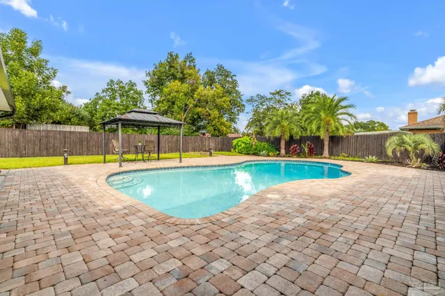 a view of a swimming pool and a chairs