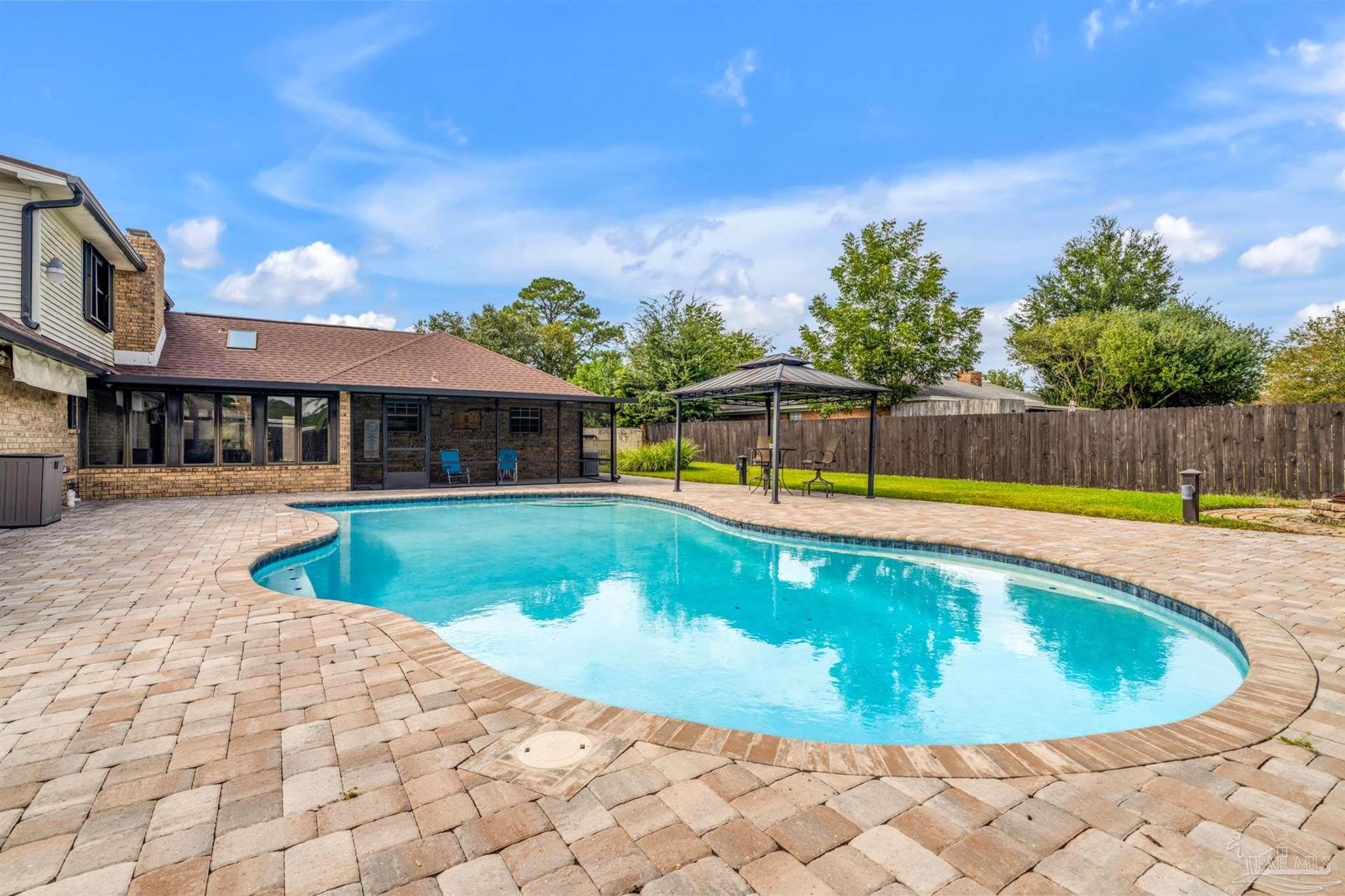 6912 Kitty Hawk Drive Pensacola, FL 32506 - Photo 8 of 61 a view of a swimming pool and a chairs