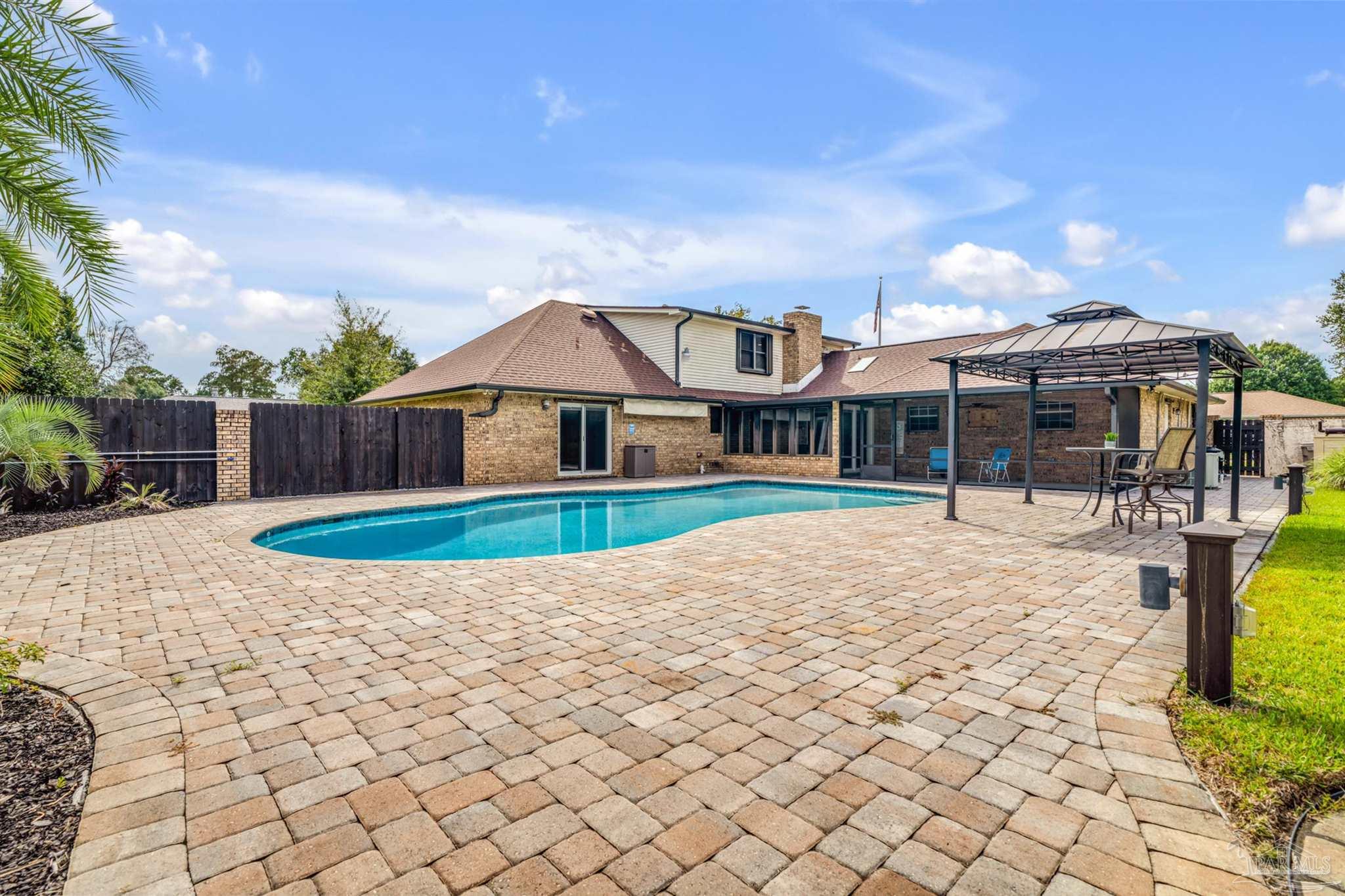6912 Kitty Hawk Drive Pensacola, FL 32506 - Photo 9 of 61 a front view of a house with a yard