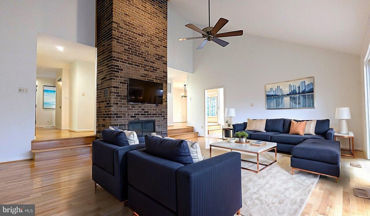 11589 Lake Newport Road Reston, VA 20194 - Photo 2 of 66 a living room with fireplace furniture and a wooden floor
