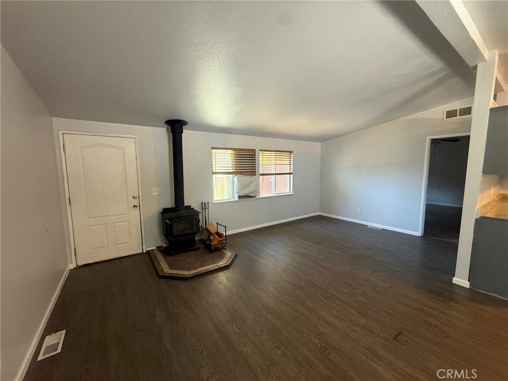 6845 Floyd Way Nice, CA 95464 - Photo 8 of 59 a living room with hard wood floors and a window