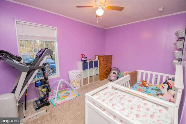 a bedroom with furniture and a wooden floor