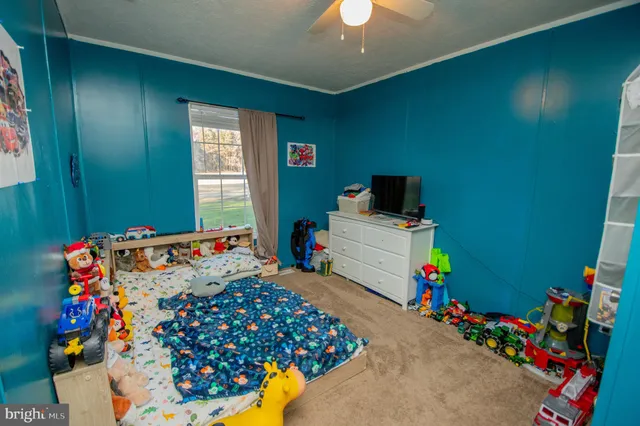 a bed room with a bed and a baby crib