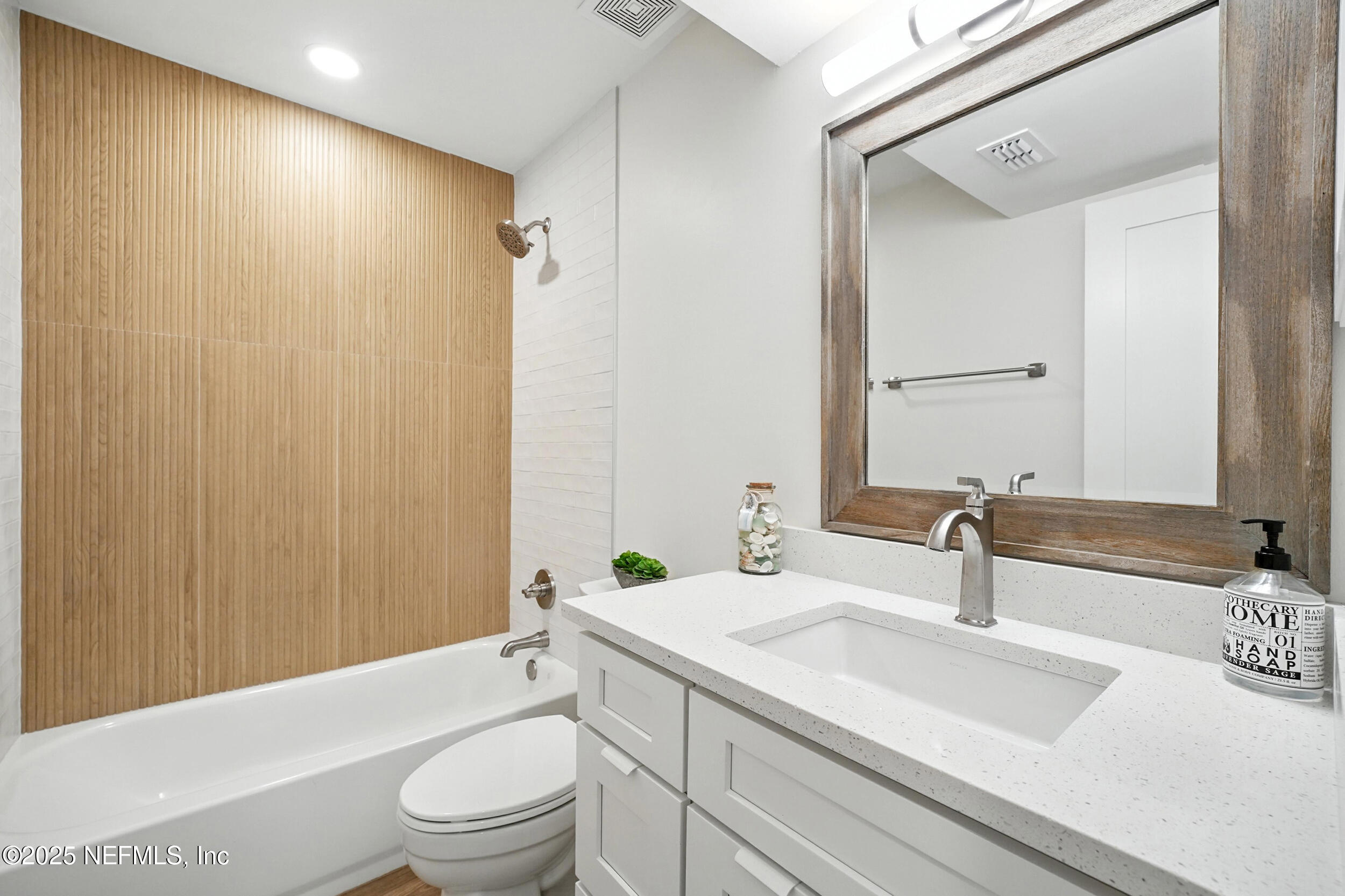 573 Aquatic Drive Atlantic Beach, FL 32233 - Photo 14 of 26 a bathroom with a sink a toilet and shower