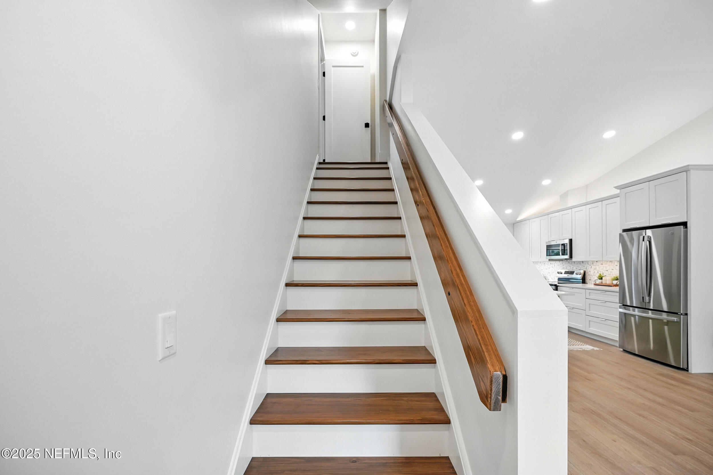 573 Aquatic Drive Atlantic Beach, FL 32233 - Photo 15 of 26 a view of entryway and hall with wooden floor