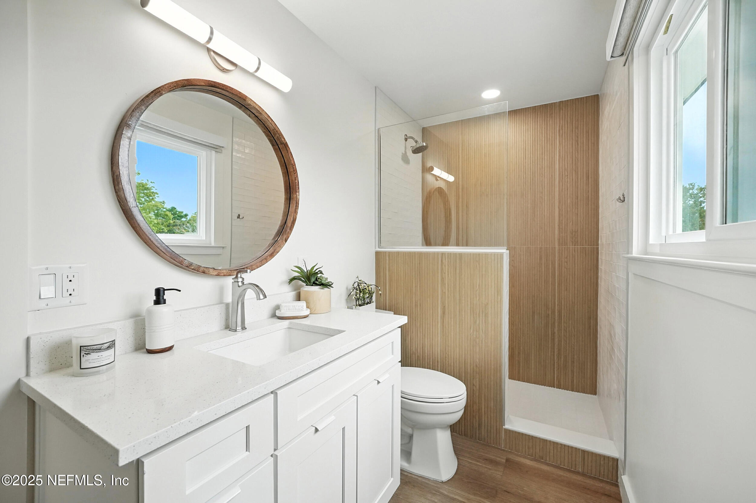 573 Aquatic Drive Atlantic Beach, FL 32233 - Photo 18 of 26 a bathroom with a sink and a mirror