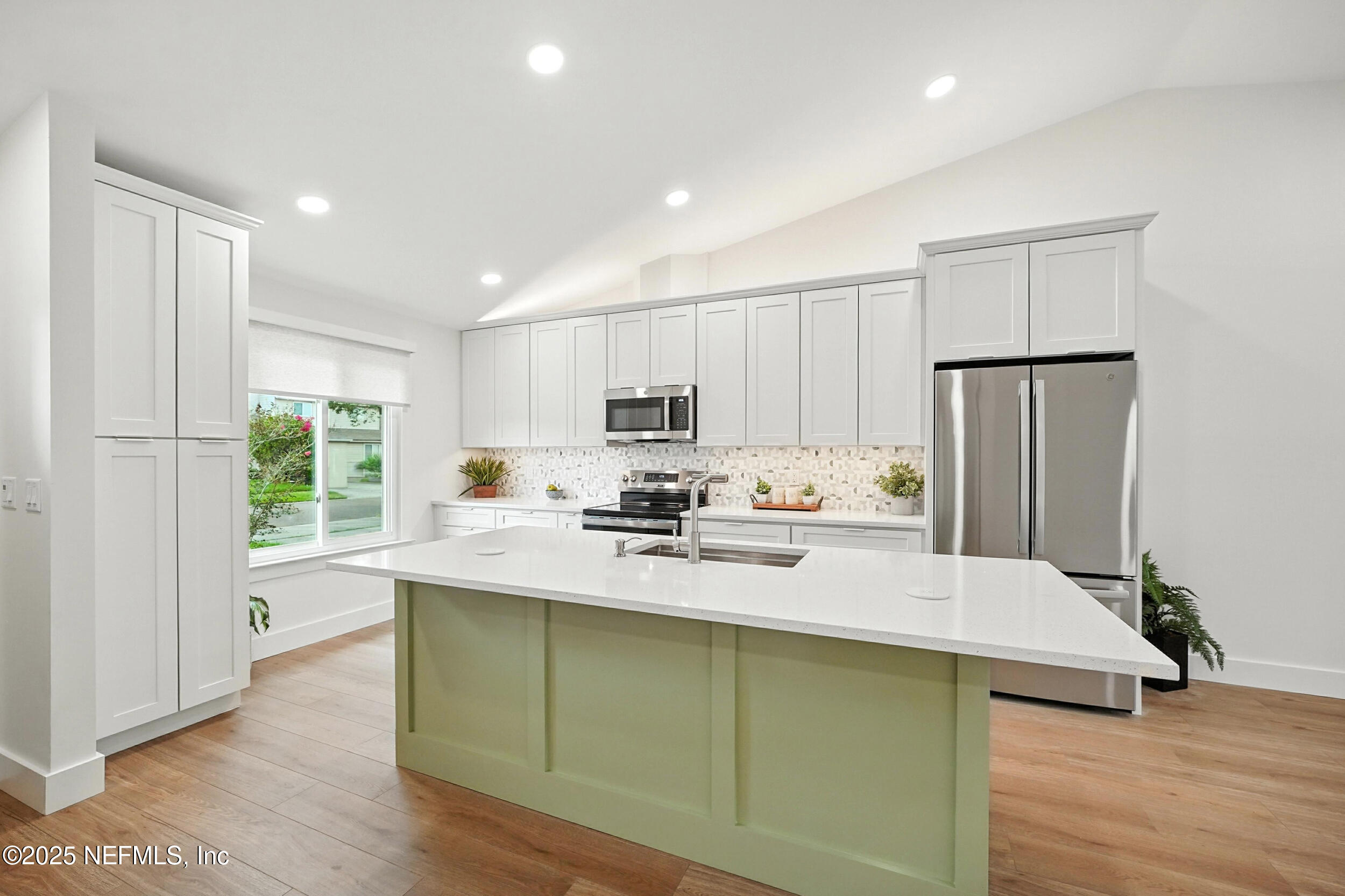 573 Aquatic Drive Atlantic Beach, FL 32233 - Photo 2 of 26 a kitchen with stainless steel appliances granite countertop a refrigerator sink and microwave