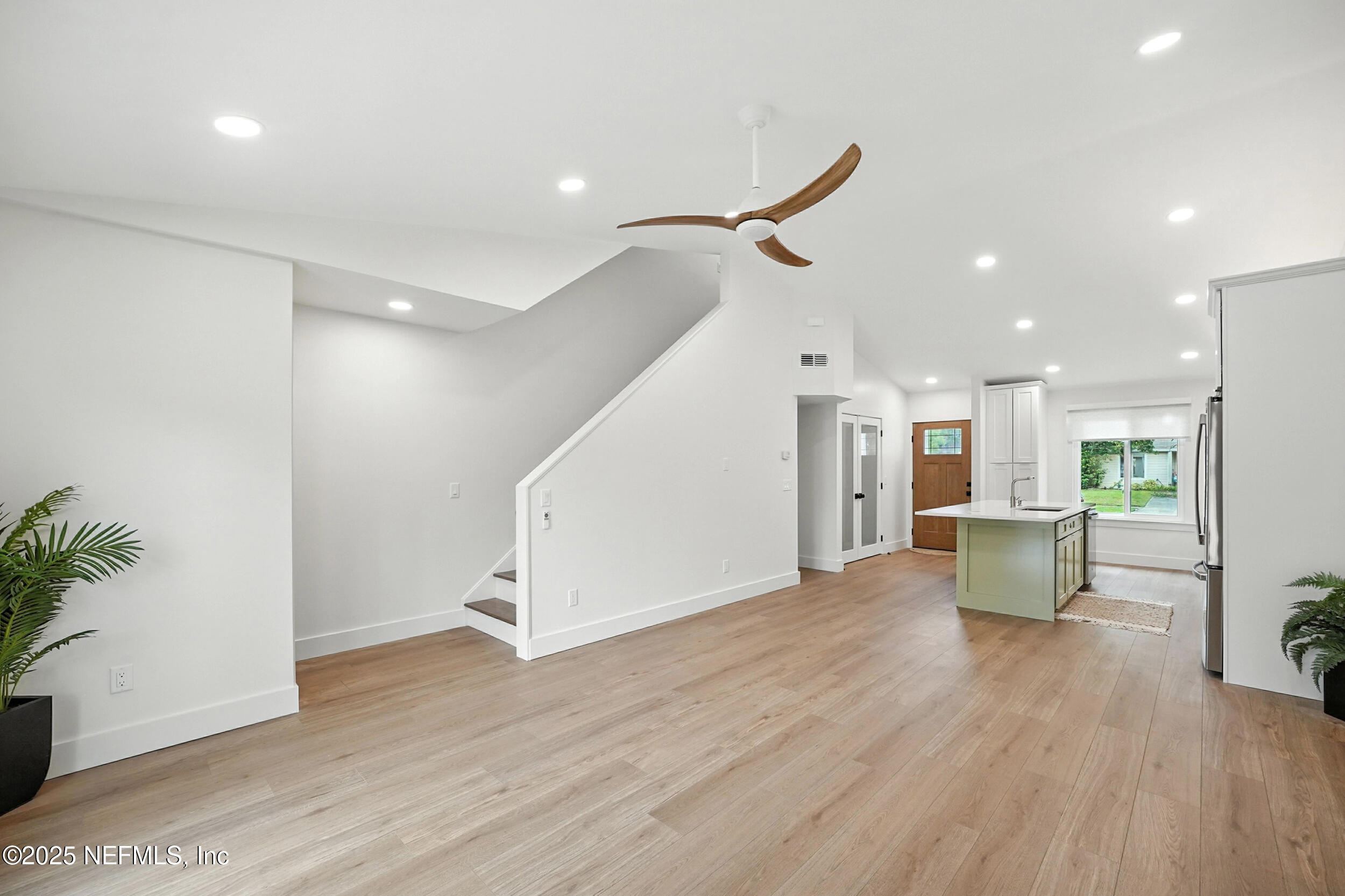 573 Aquatic Drive Atlantic Beach, FL 32233 - Photo 6 of 26 a view of an empty room and wooden floor