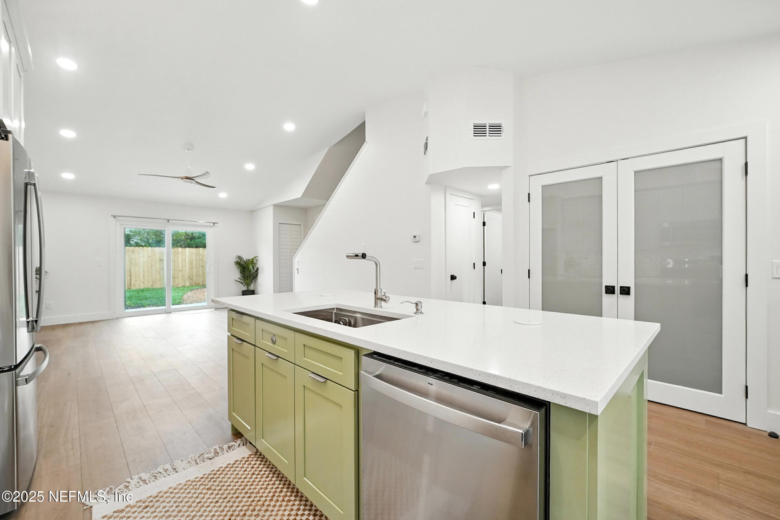 573 Aquatic Drive Atlantic Beach, FL 32233 - Photo 9 of 26 a kitchen with a sink and a refrigerator
