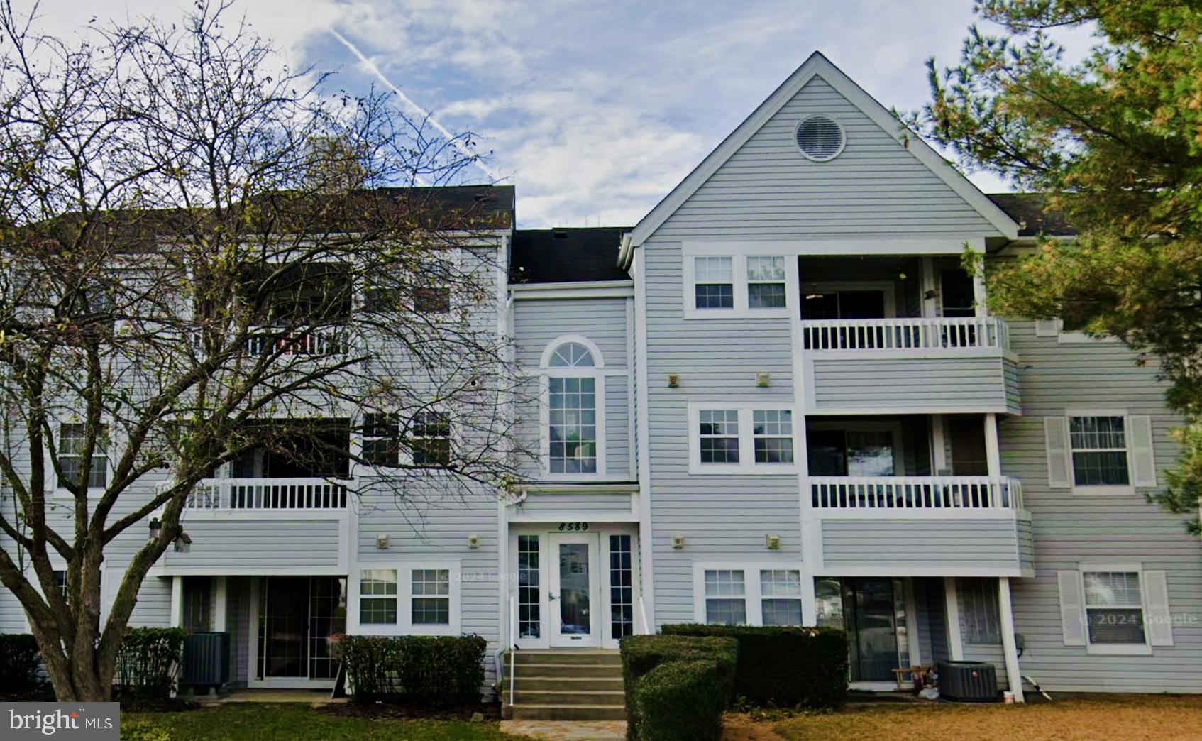 a front view of a building with a lot of windows