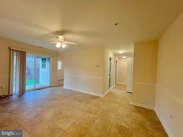 a view of an empty room with a bathroom