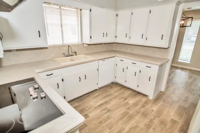 a kitchen with stainless steel appliances a refrigerator and a sink