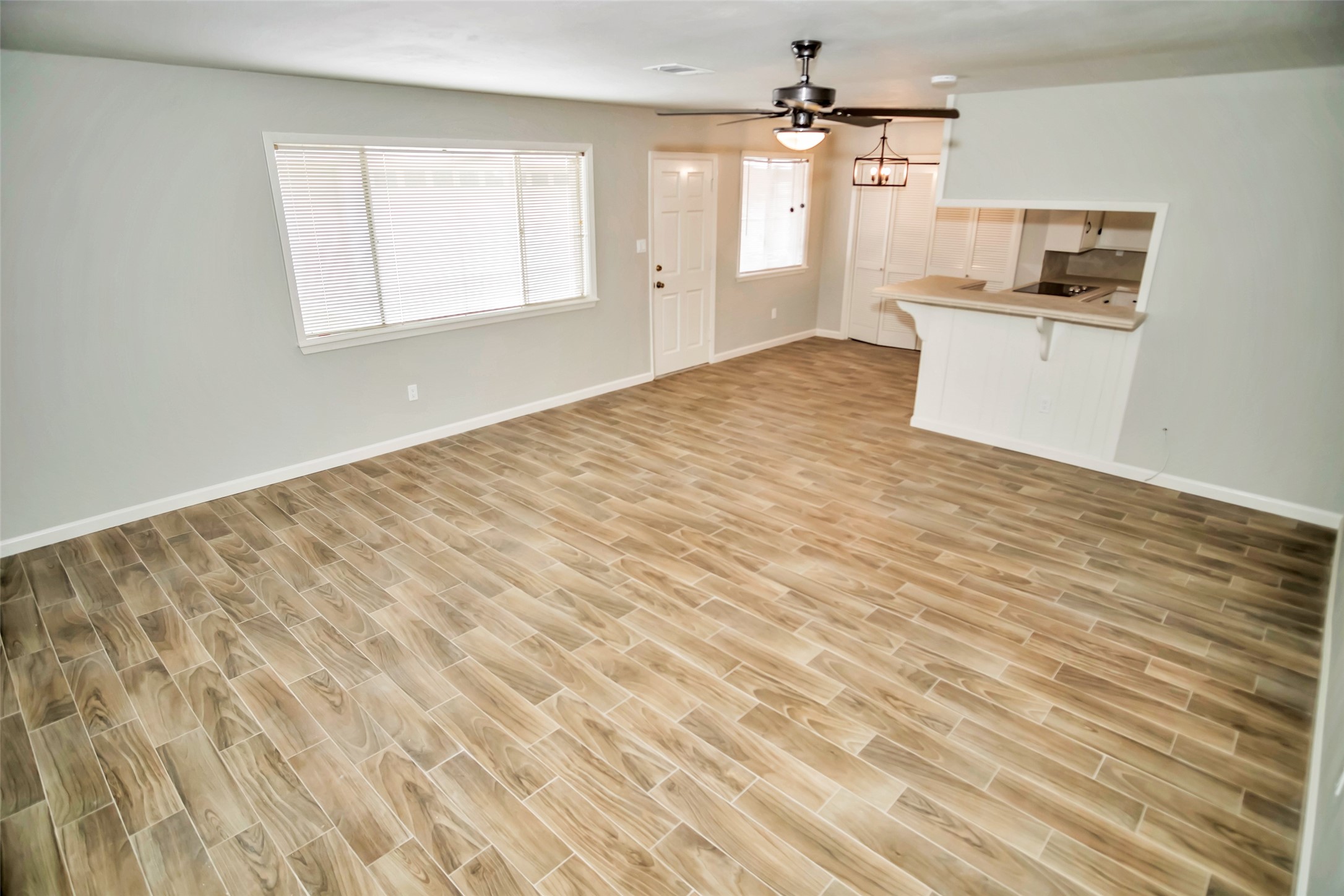 1715 Capstan Road Houston, TX 77062 - Photo 16 of 40 wooden floor in an empty room with a window
