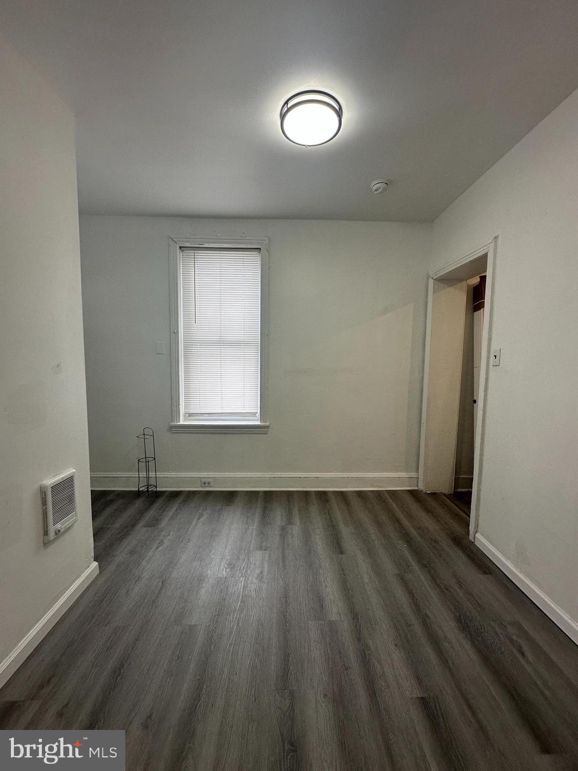 3843 Baring Street Philadelphia, PA 19104 - Photo 12 of 30 an empty room with wooden floor and windows