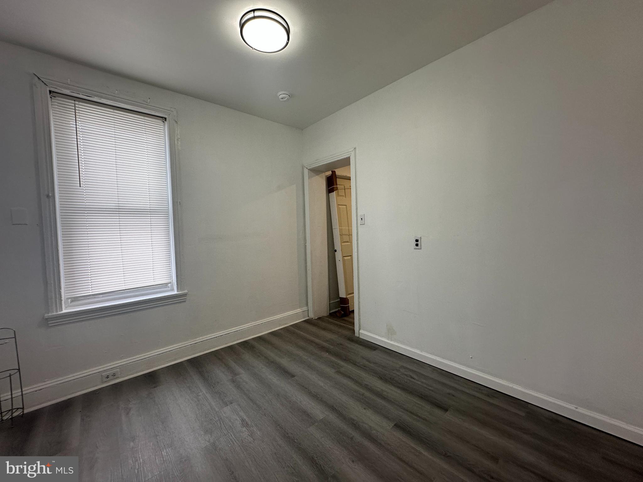 3843 Baring Street Philadelphia, PA 19104 - Photo 13 of 30 an empty room with wooden floor and windows