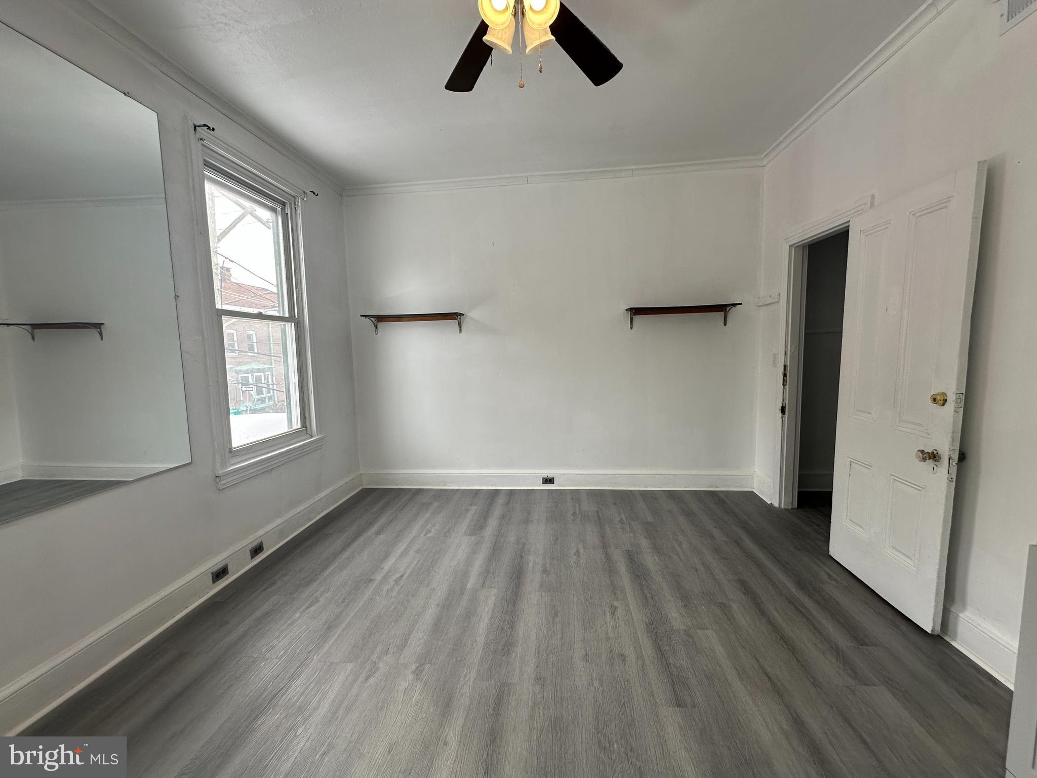3843 Baring Street Philadelphia, PA 19104 - Photo 20 of 30 wooden floor in an empty room with a window