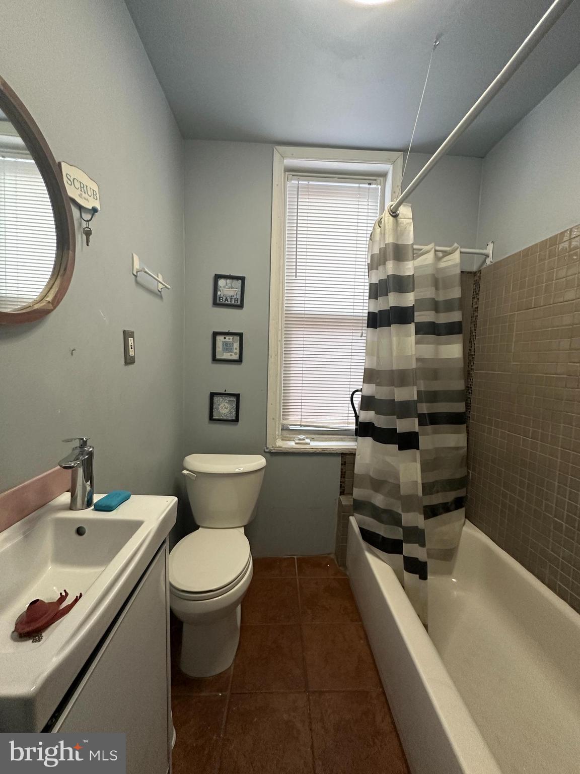 3843 Baring Street Philadelphia, PA 19104 - Photo 22 of 30 a bathroom with a sink a toilet and a bathtub