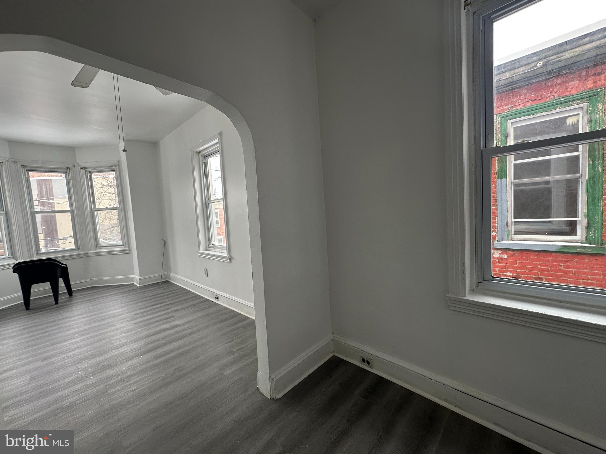 3843 Baring Street Philadelphia, PA 19104 - Photo 25 of 30 an empty room with wooden floor and windows