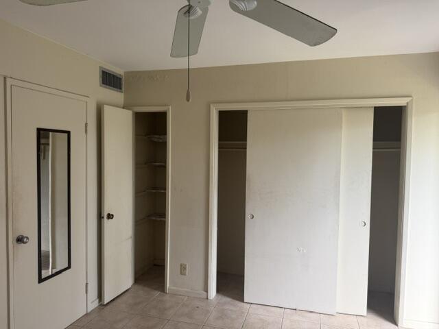660 Glouchester Street, Unit 206 Boca Raton, FL 33487 - Photo 12 of 13 a hallway with wooden floor and entryway